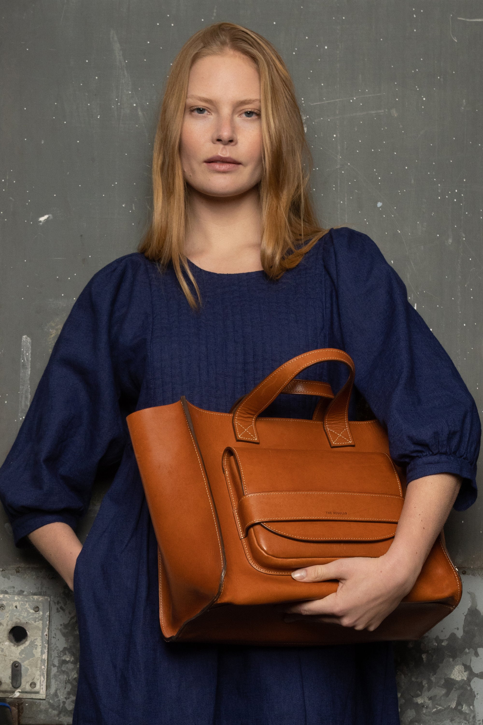 tan leather pioneer tote and quilt dress in french blue linen