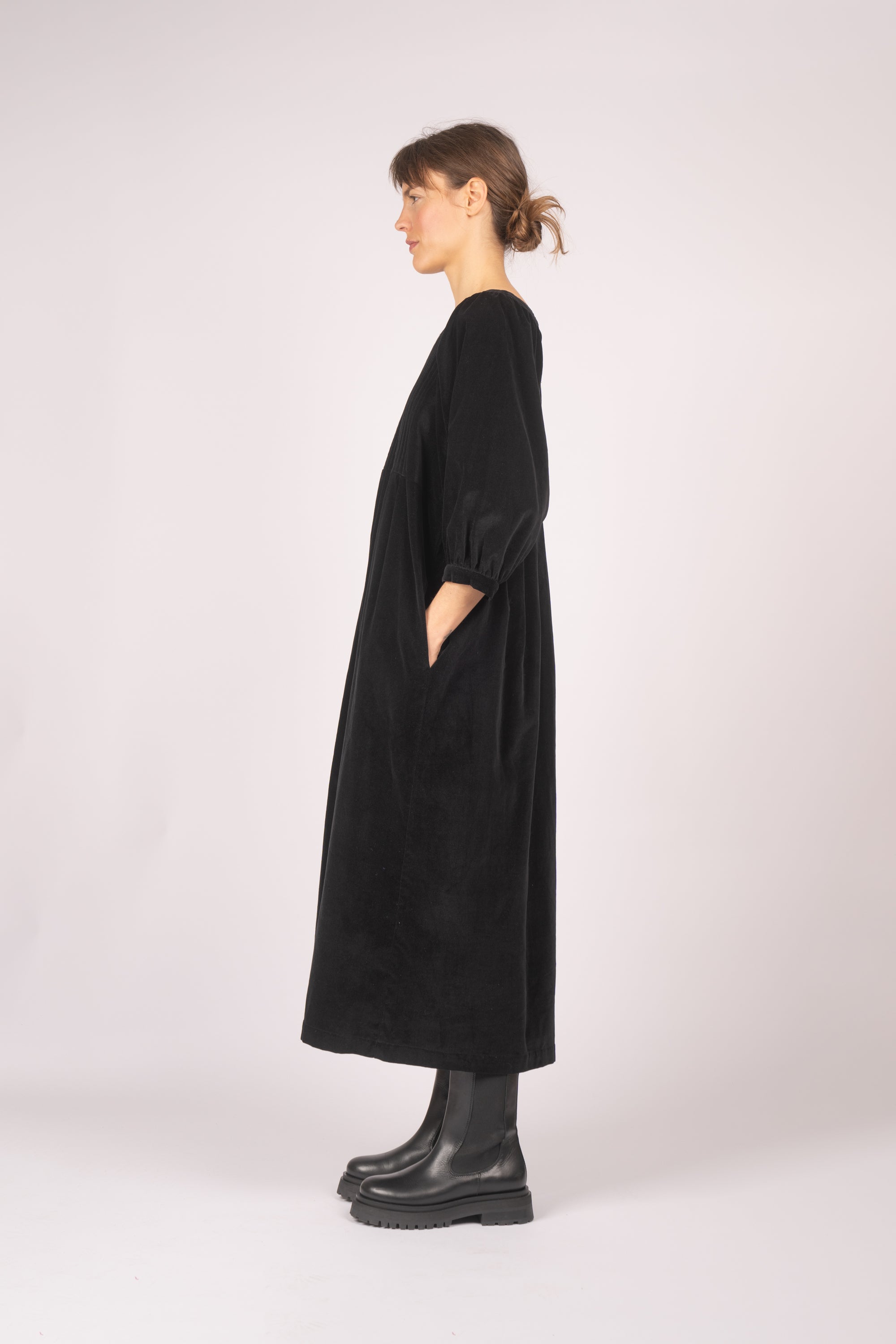model wears black velvet quilt dress from fashion brand THE REGULAR